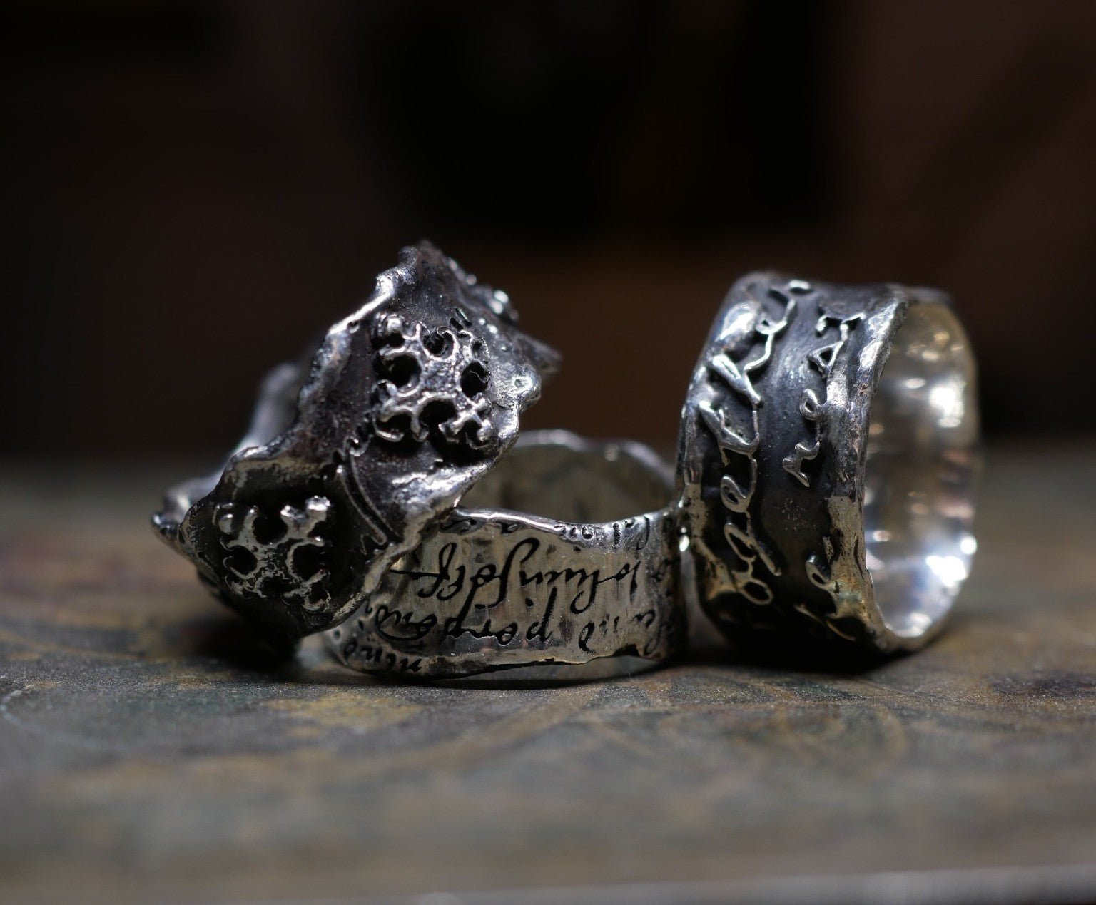 Aurum Deorum deconstructed sterling silver rings with fused historical text and ornament