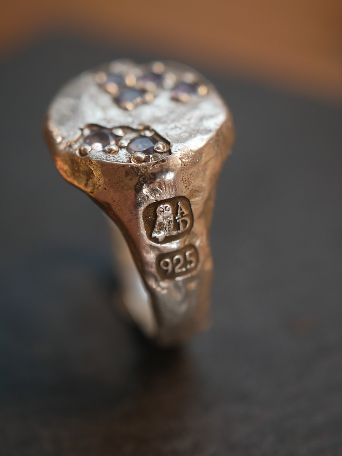 Aurum Deorum owl and A.D. maker's mark beside a 925 sterling silver fineness mark on a handmade ring